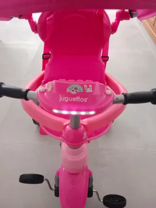 Triciclo Juguettos rosa con capota