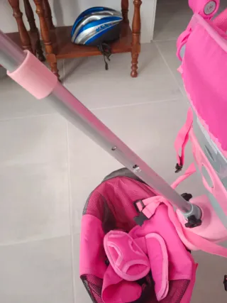 Triciclo Juguettos rosa con capota