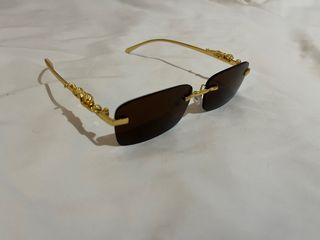 Gafas de sol de lujo doradas