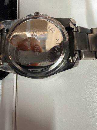 Reloj Skyline Verde y Plateado