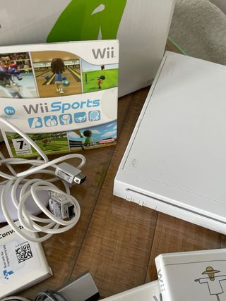 Consola Nintendo Wii con accesorios y juegos.