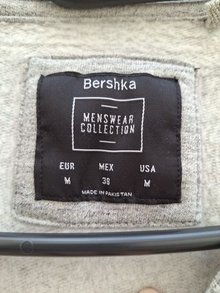 Sudadera gris con cremallera lateral