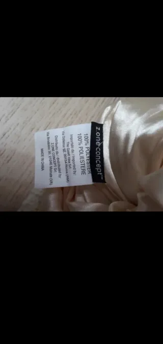 Berretto lana beige con pompon