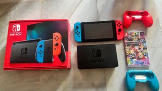 Nintendo Switch + Mario Kart + Volante + Mando Pro