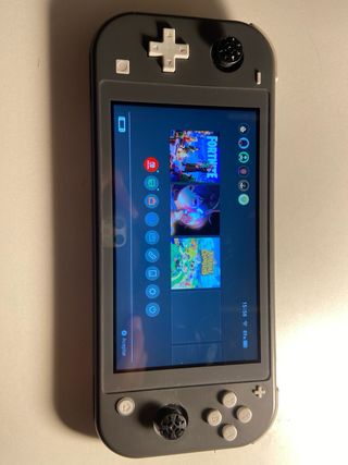 Nintendo Switch Lite Gris + Juego Animal Crossing