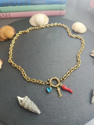 Collana acciaio dorata con ciondoli