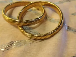 Brazaletes acero dorados estilo serpiente