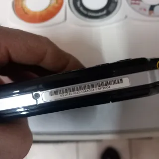 Sony PSP amb accessoris i jocs. No bateria.