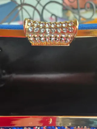 Bolso de fiesta azul con detalles dorados