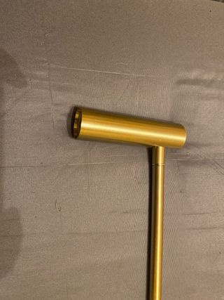 Lámpara de pared dorada de metal