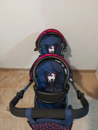 Carro gemelar de juguete con bolso