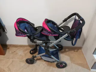 Carro gemelar de juguete con bolso