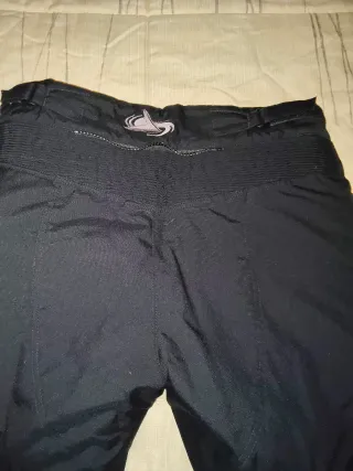 Pantalón de moto negro y rosa