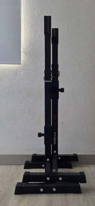 Banco de pesas y barra con discos