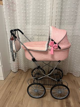 Coche de muñecas rosa