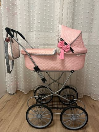 Coche de muñecas rosa