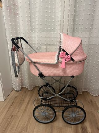 Coche de muñecas rosa