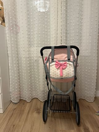 Coche de muñecas rosa