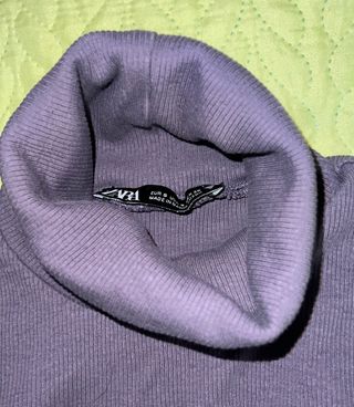 Top cuello alto sin mangas gris