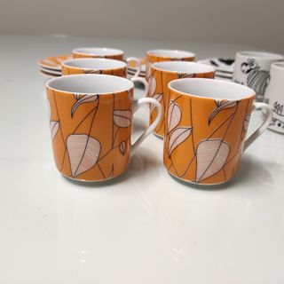 2 Juegos de café porcelana naranja y otro de vacas