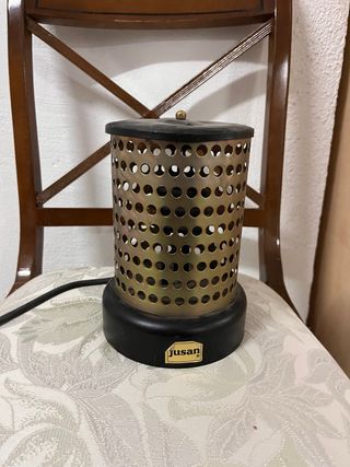 Estufa Jusan redonda metal dorada