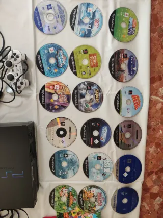 PS2 + 16 juegos + 4 mandos+ 8 Buzz con y sin cable