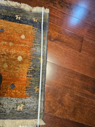 Alfombra de lana gris y naranja