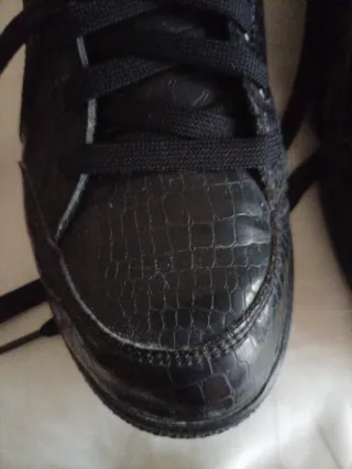 Sneakers Puma alte nere con dettagli rosa