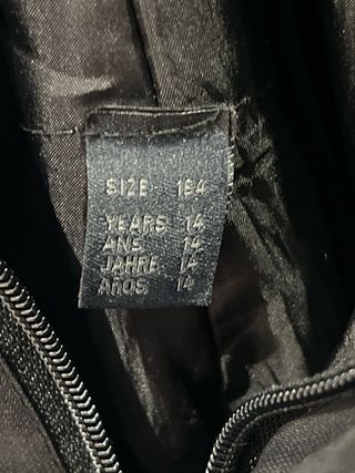 Equipación de esquí naranja y negra T.14-16