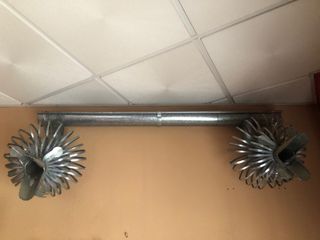 Gárgolas de chapa para canalón echas a mano.