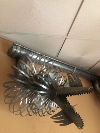 Gárgolas de chapa para canalón echas a mano.