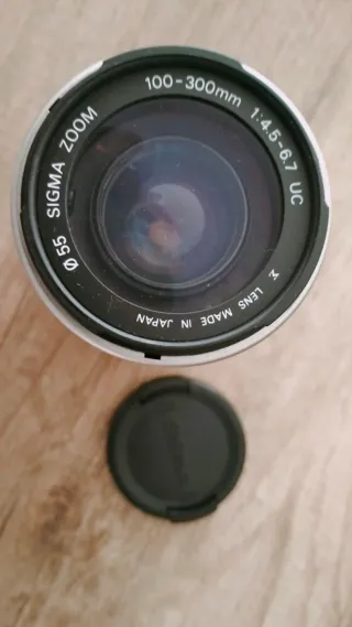 Objetivo Sigma 100-300mm Canon EF y batería Lp e6
