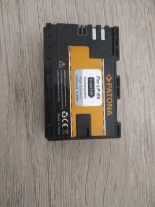 Objetivo Sigma 100-300mm Canon EF y batería Lp e6