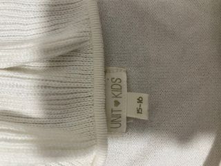 Cárdigan blanco con cuello volantes