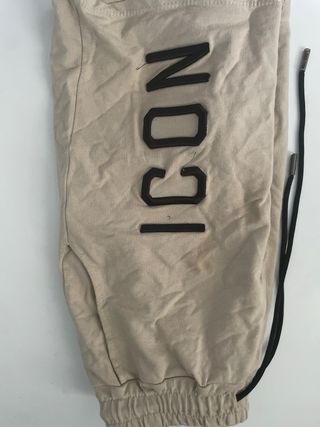 Pantalones beige con cordones negros