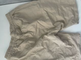 Pantalones beige con cordones negros