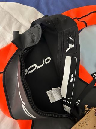 Traje de neopreno Orca naranja y negro