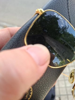 Gafas de sol Ray-Ban doradas y verdes