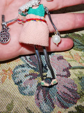 Collana bambola con racchetta e perla