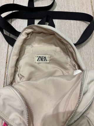 Minimochila niña beige con detalles rosa