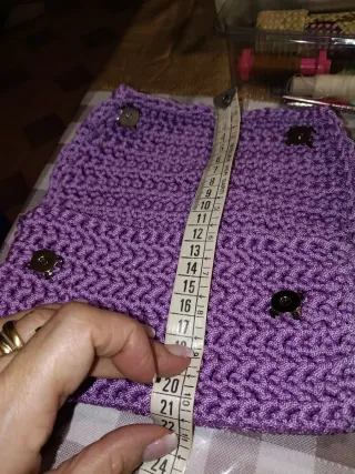 Pochette lilla con catena polso