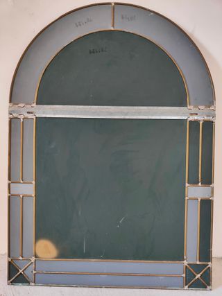 Specchio ad arco con cornice dorata