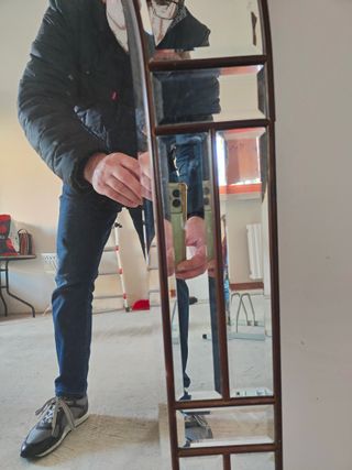 Specchio ad arco con cornice dorata