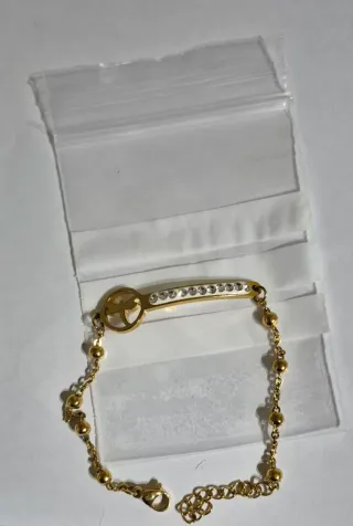 Pulsera dorada con abalorios y circonitas