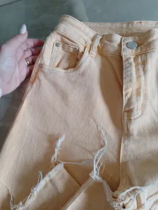 Jeans donna strappati color pesca