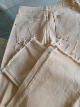 Jeans donna strappati color pesca