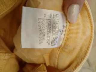 Jeans donna strappati color pesca