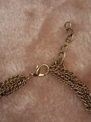 Collar largo metálico dorado con borla