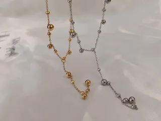 Collar de acero con esferas bañado en oro 18K