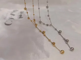 Collar de acero con esferas bañado en oro 18K